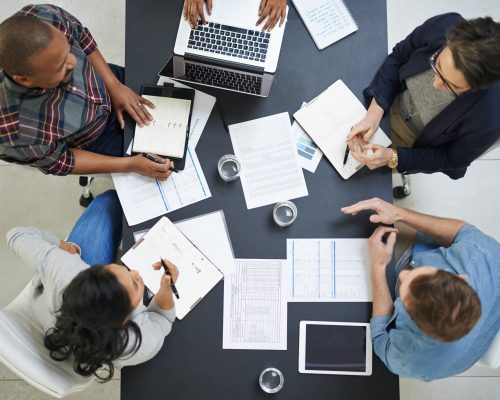 High angle shot of a team of colleagues having a meeting in a office